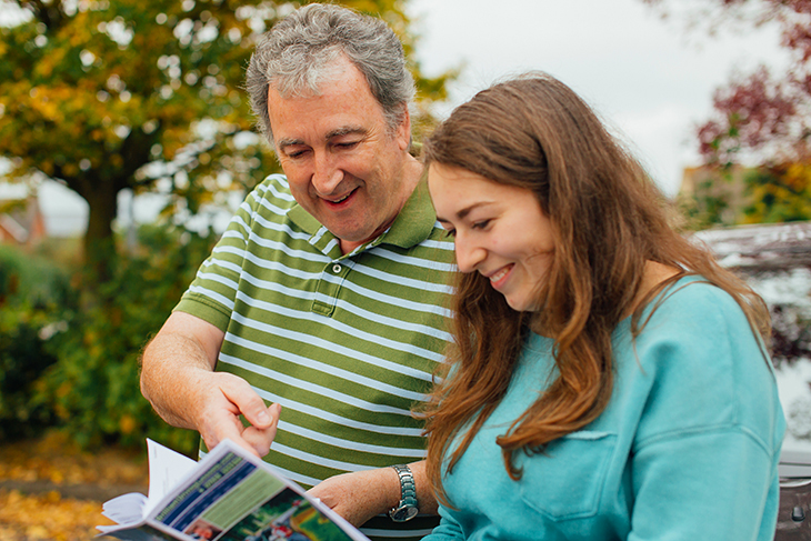 Hattie Lambert With instructor studying handbook